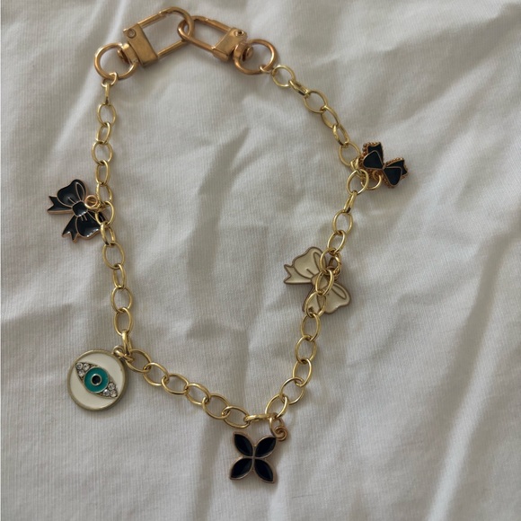 Jewelry - Gold Tone Charm Bracelet Evil Eye Bow & Floral Charms Adjustable Chain Bracelet
